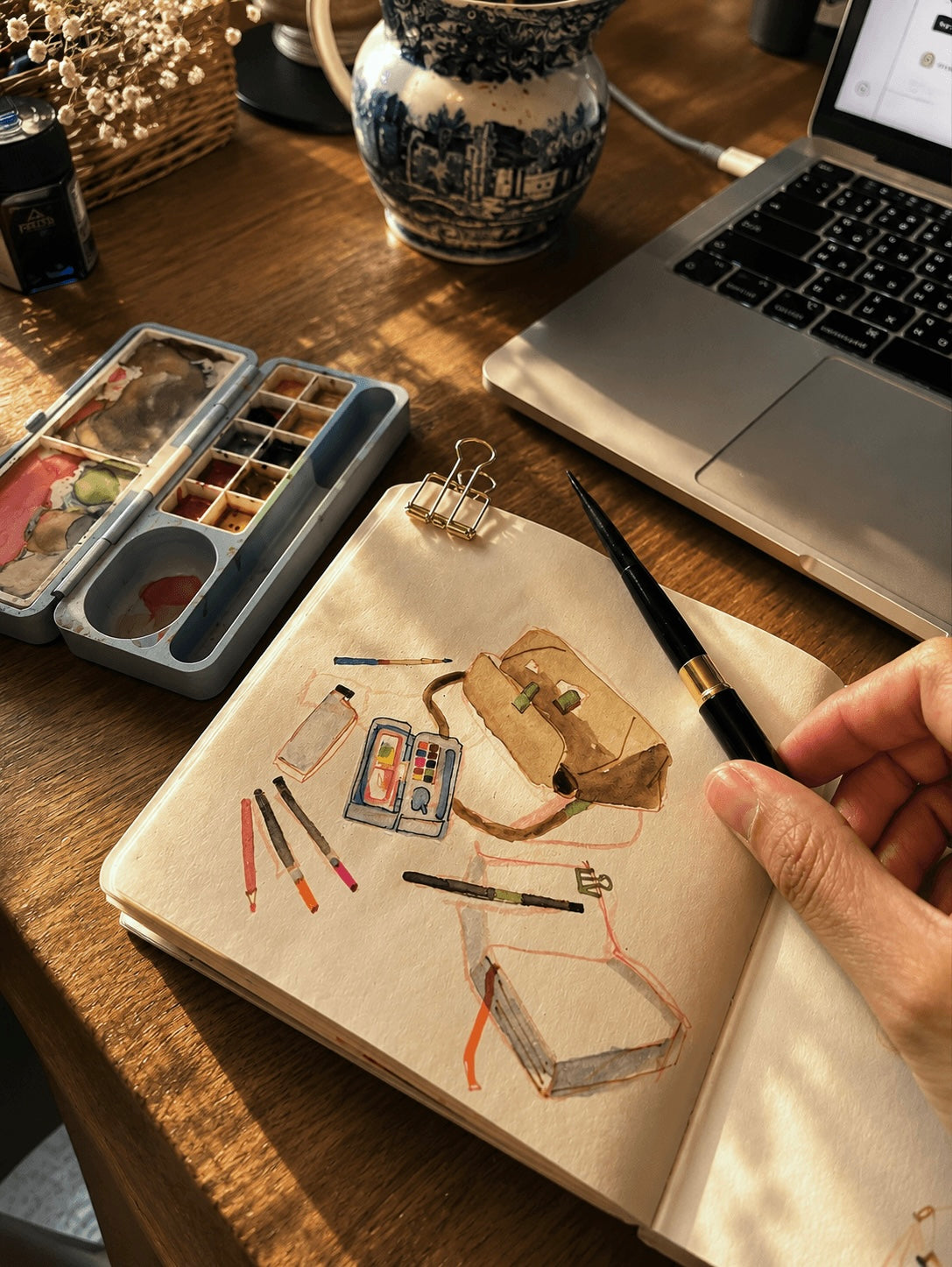 Sketchbook with watercolour art supplies illustration