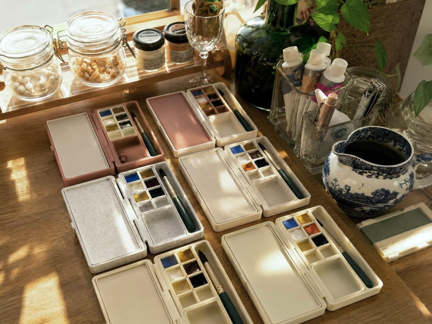 Six open palette cases on the desk