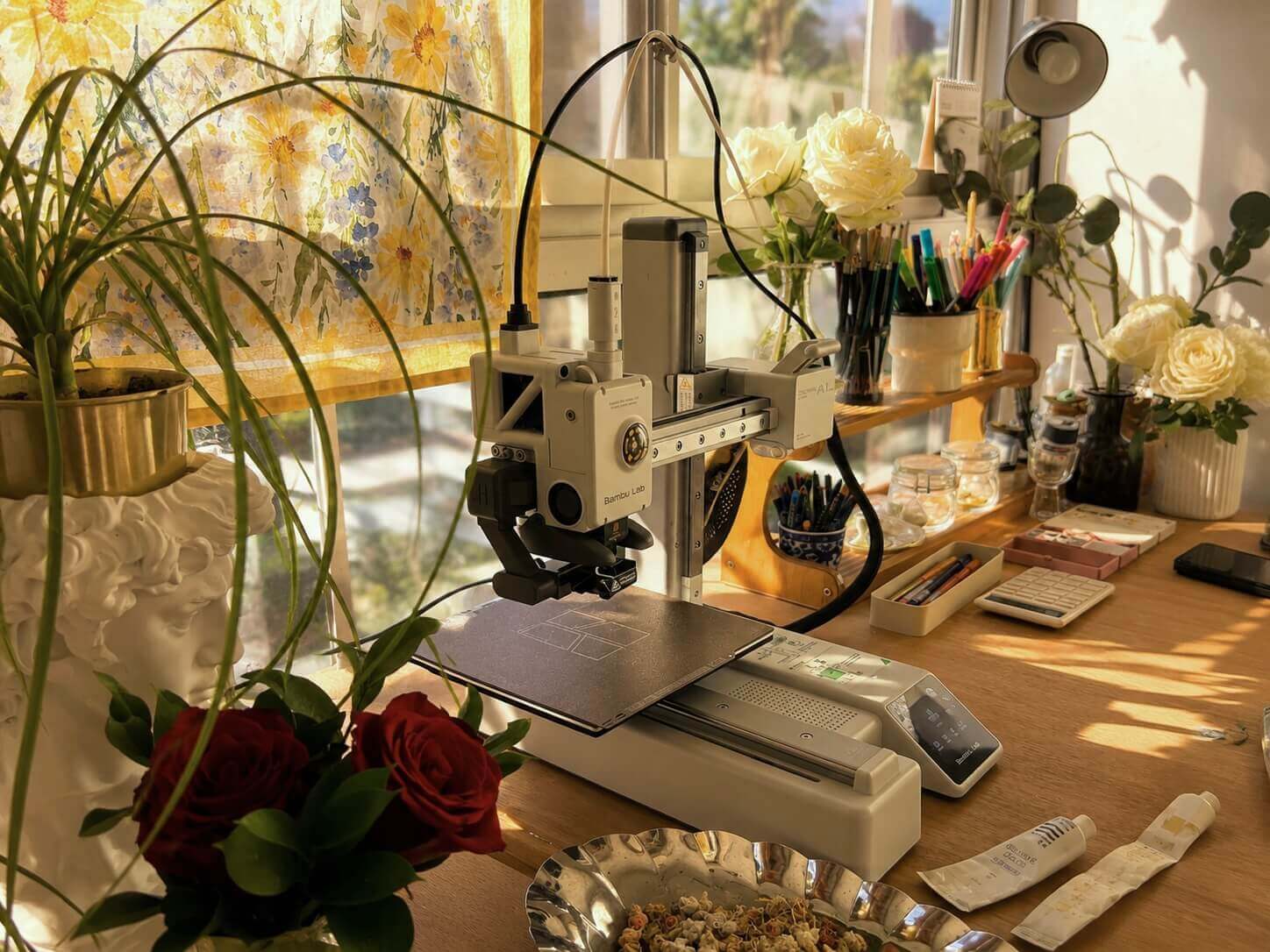 3D printer surrounded by roses