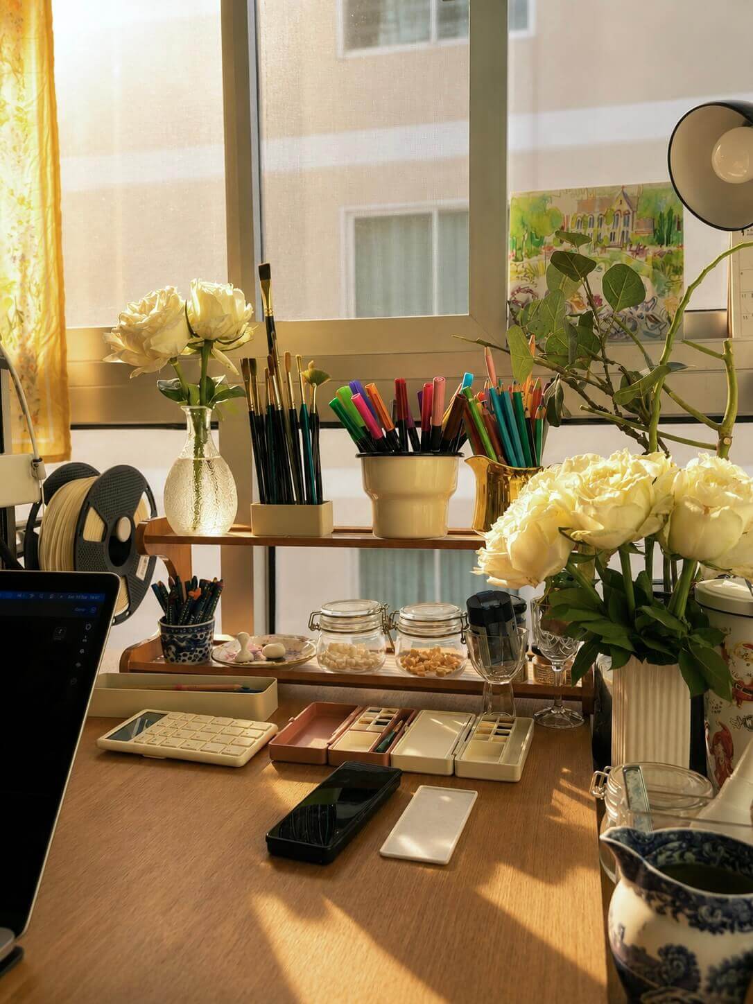 Studio shelf with brushes and palette